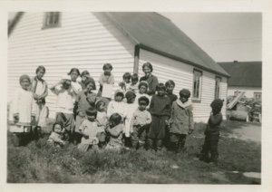 Image of Children outside MacMillan's School, with Kate Hettasch